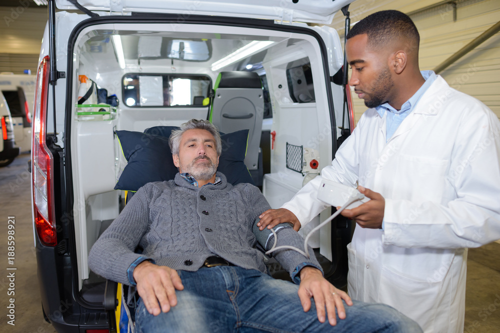 checking the victim's pulse rate checking the victim's pulse rate