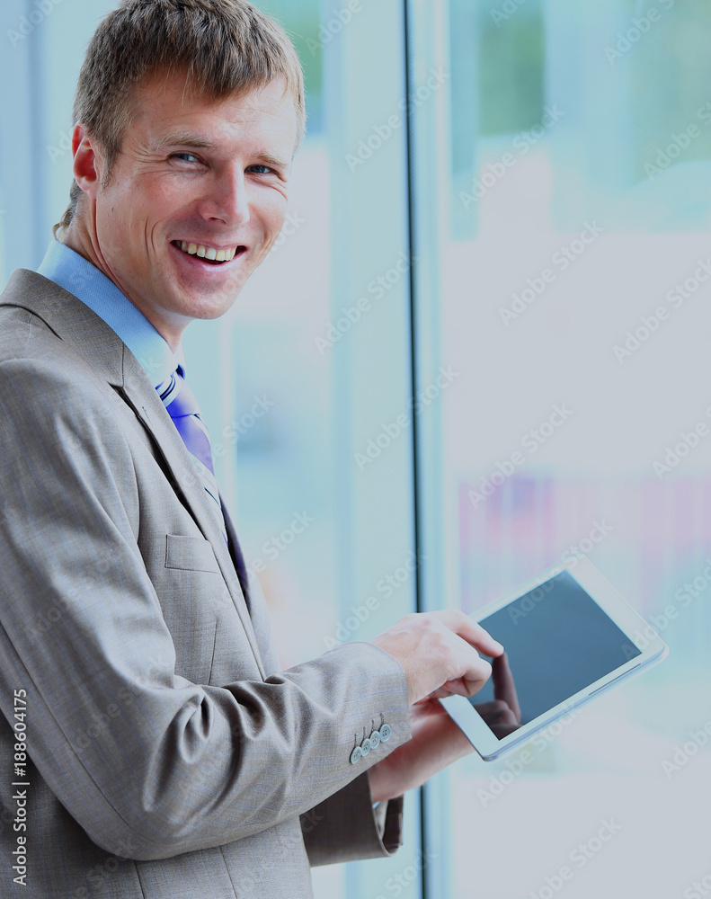 Portrait of a businessman working on his tablet. Portrait of a businessman working on his tablet.