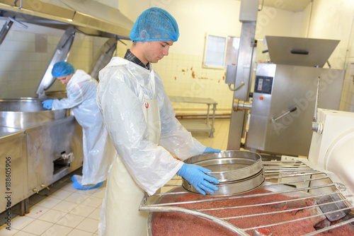 young man working on a food processing factory photo
