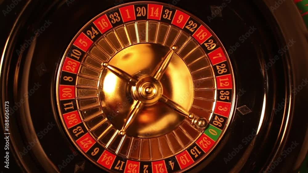 The small ball falls into slot as the Roulette Wheel spins The small ball falls into slot as the Roulette Wheel spins