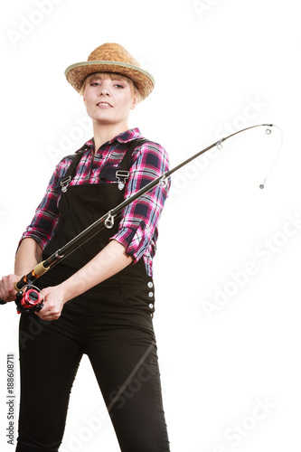 Happy woman in sun hat holding fishing rod photo