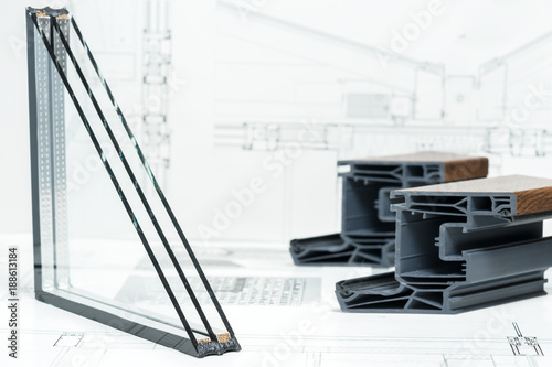 A cross section of window Design of pvc profiles for window, triple glazing cross selection, technical drawing on background photo