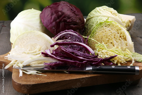 Shredded cabbage,  white cabbage, red cabbage and savoy on cutting board