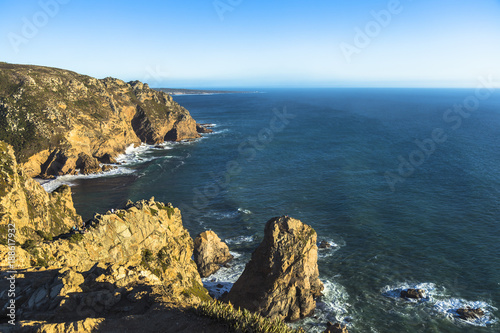 The cape Cabo da Roca in Portugal. Cliffs and rocks at the Atlantic ocean coast in Sintra in a sunny summer day