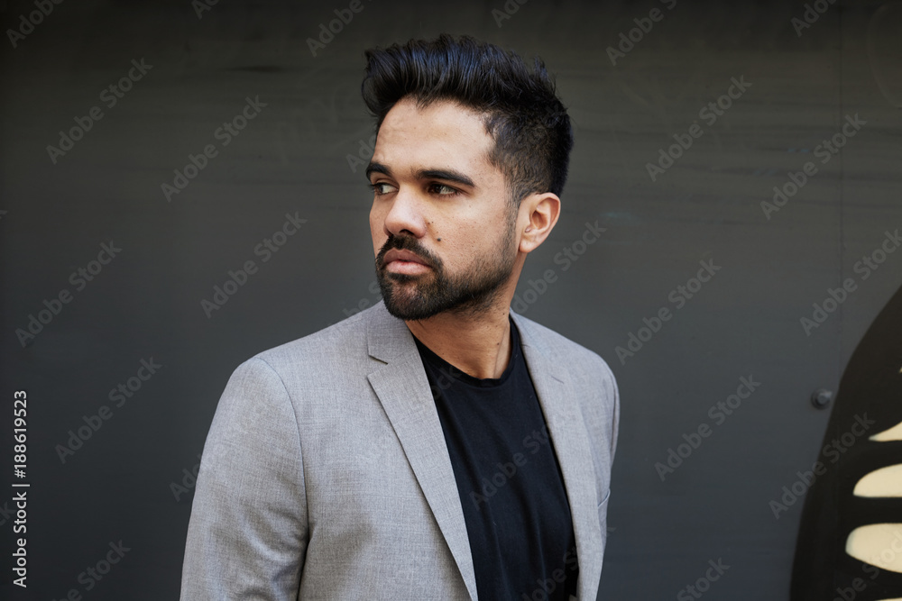 Portrait Of Serious Man On Black Background