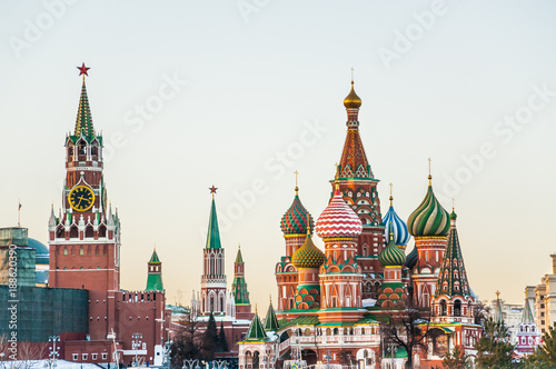 View of the Spasskaya tower of the Moscow Kremlin and St. Basil's Cathedral on a winter evening