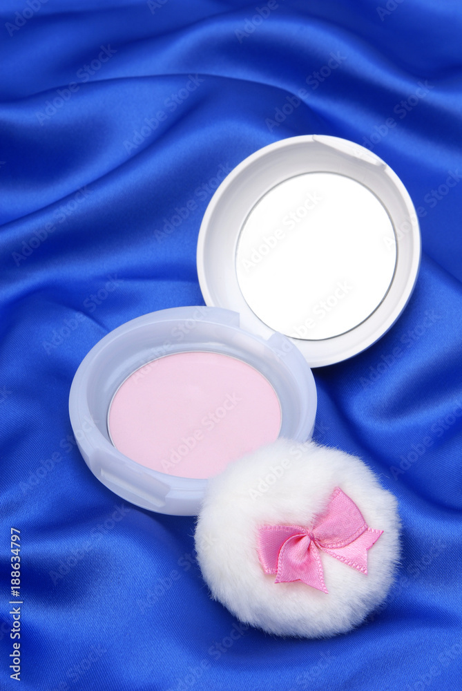 Face powder on blue background Face powder on blue background