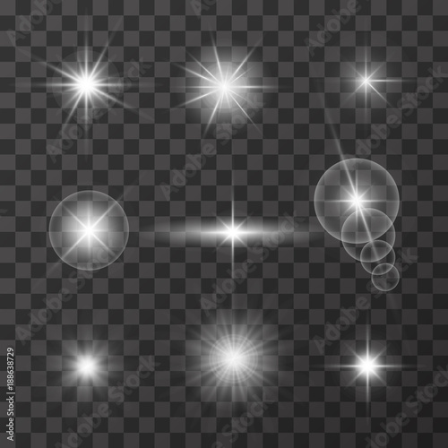Realistic glare of light. Collection of white stars with glare on a dark transparent background. Light vector effect. Vector illustration. photo