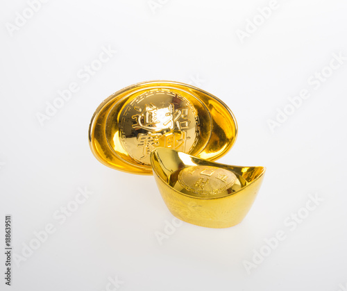 Gold or Chinese gold ingot mean symbols of wealth and prosperity on a background. photo