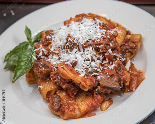 Paccherri Alla Norma: Paccheri pasta with eggplant, marinara sauce and salted ricotta