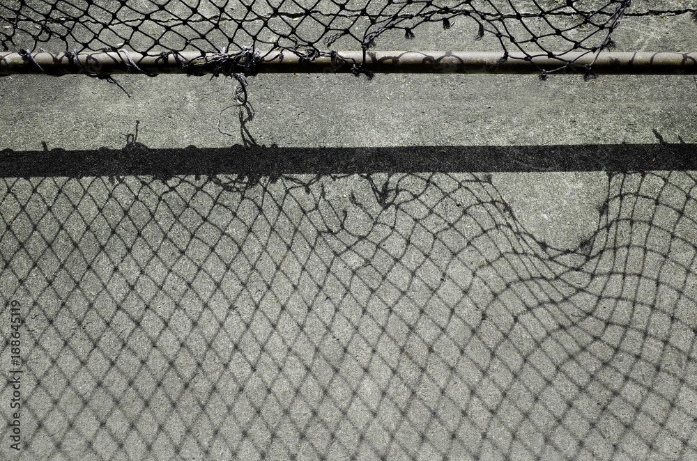 Black Shade of Shadow Hole of Wire Mesh Fence Stock Photo