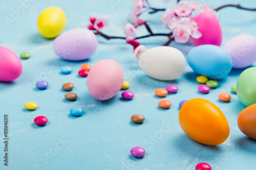 Colorful decorative eggs on spring background