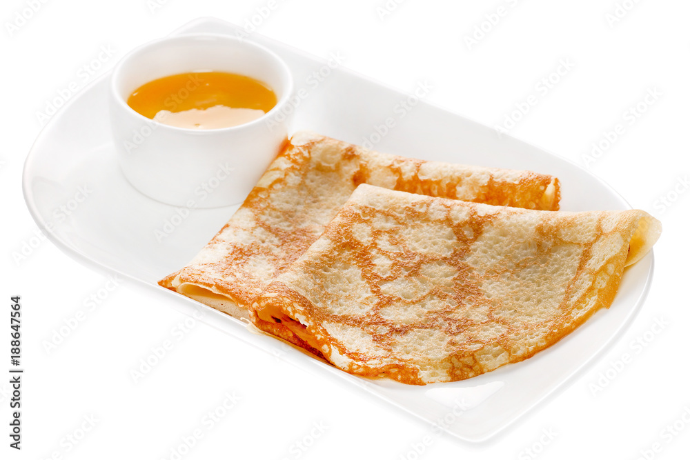 Fried pancakes on plate with sauce isolated Fried pancakes on plate with sauce isolated