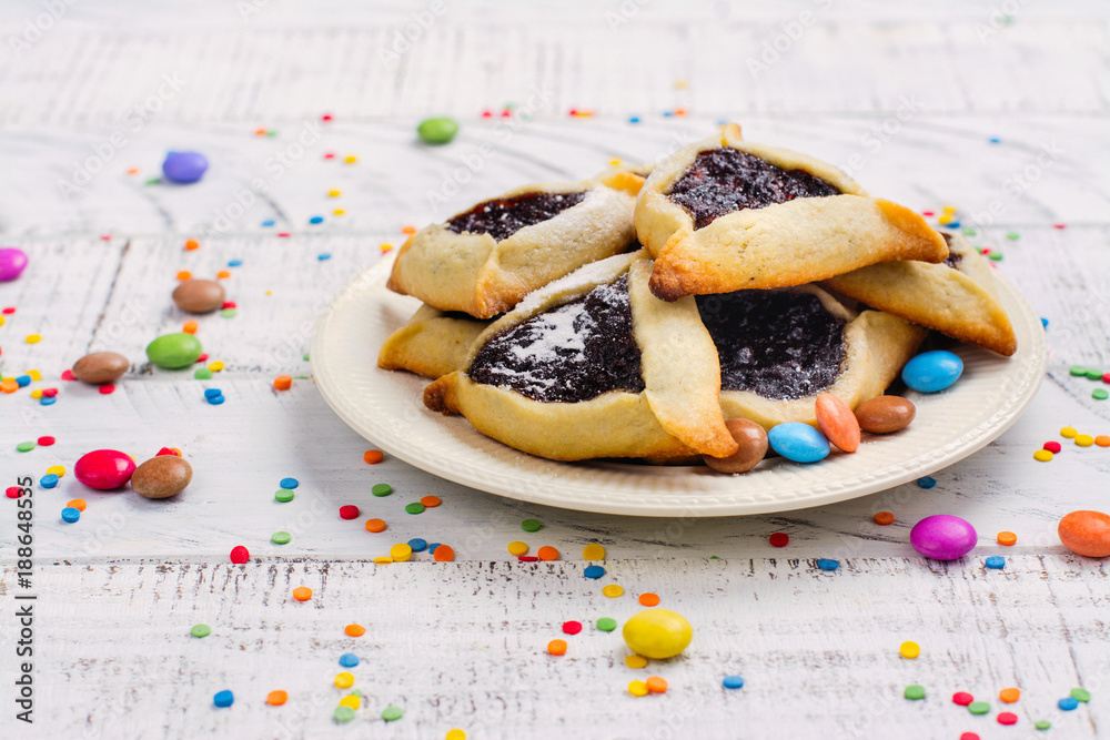 Traditional Jewish Hamantaschen cookies with berry jam. Purim celebration concept