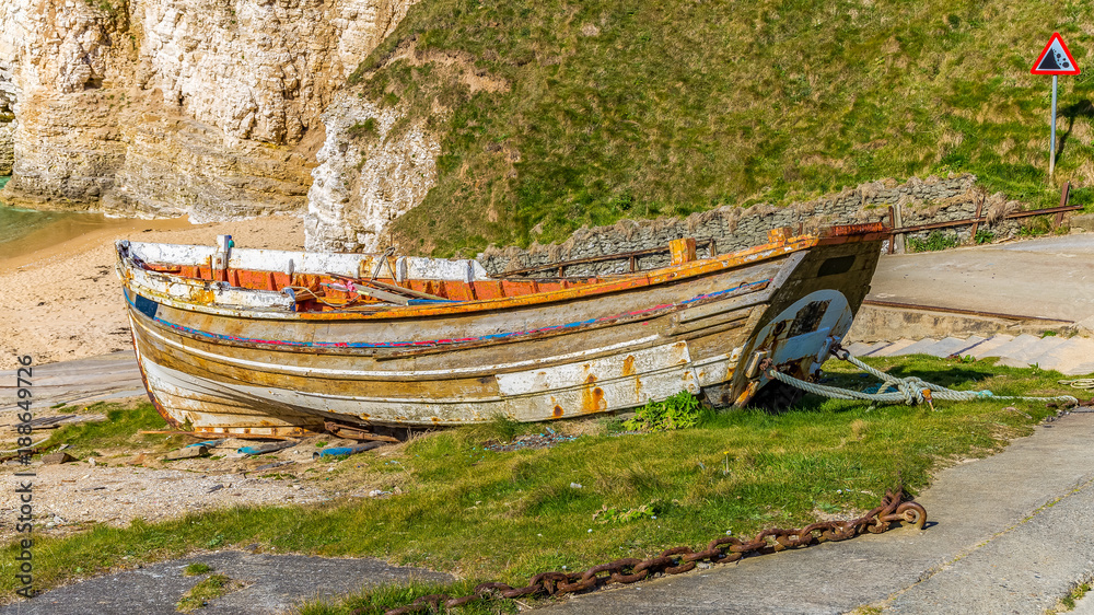 Old boat, seen at Flamborough North Landing near Bridlington, East Riding of Yorkshire, UK