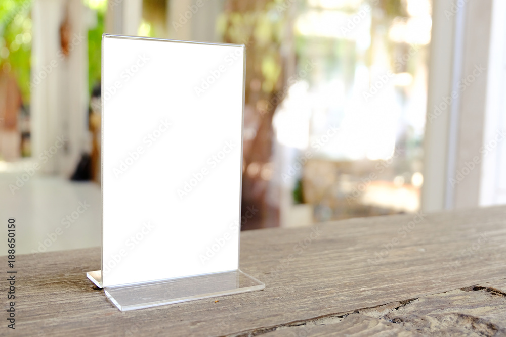 Mock up Menu frame standing on wood table in Bar restaurant cafe. space for text Mock up Menu frame standing on wood table in Bar restaurant cafe. space for text