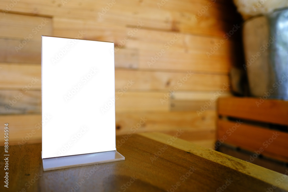 Mock up Menu frame standing on wood table in Bar restaurant cafe. space for text. Mock up Menu frame standing on wood table in Bar restaurant cafe. space for text.