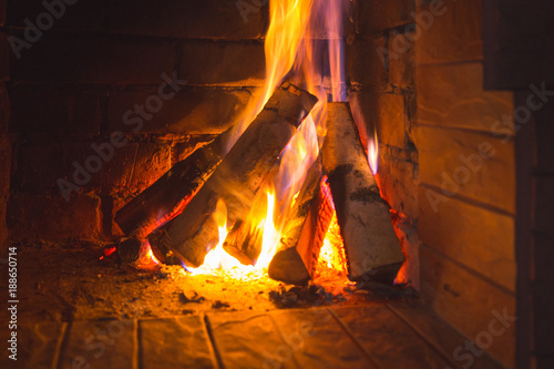 Burning wood in the fireplace.