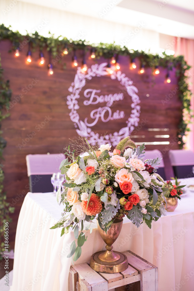 Flower arrangement at a wedding banquet. Table set for an event party or wedding reception.