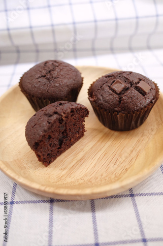 Wallpaper Mural Homemade Chocolate Cupcake and Half One on Wooden Plate 2 Torontodigital.ca