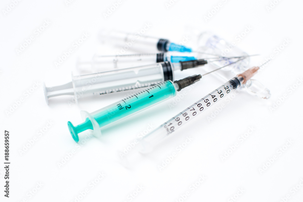 Syringes on white different sizes Syringes on white different sizes