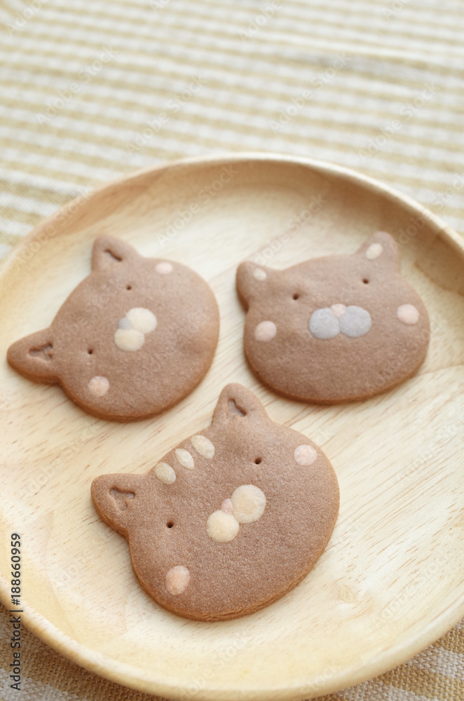 Lovely Three Pieces of Homemade Chocolate Cookies Cat Face  in Wooden Plate 