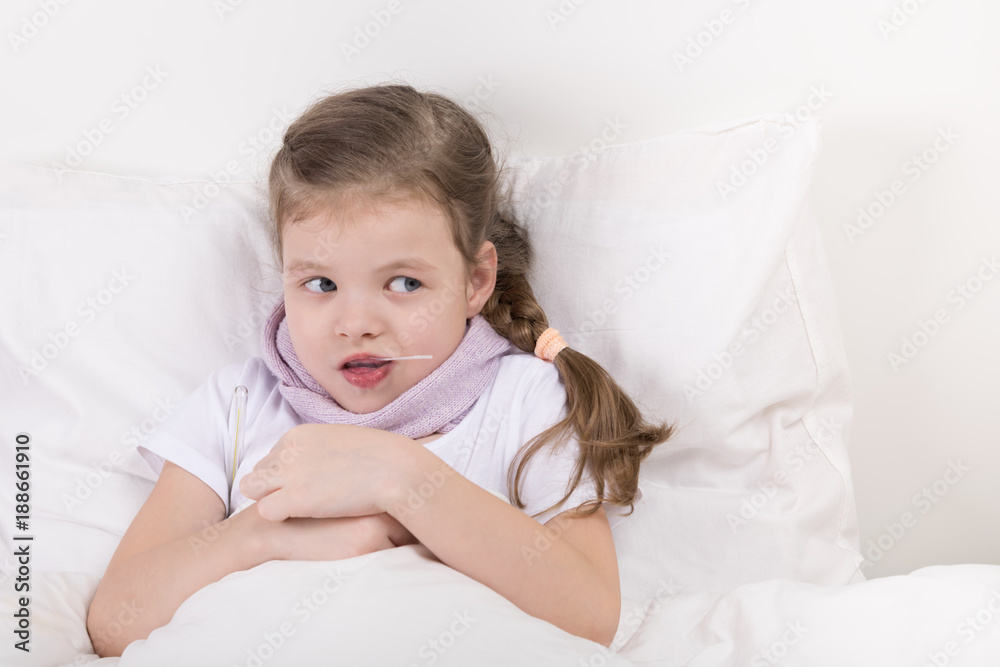 girl in bed, took a spoonful of medicine and looks at the right girl in bed, took a spoonful of medicine and looks at the right
