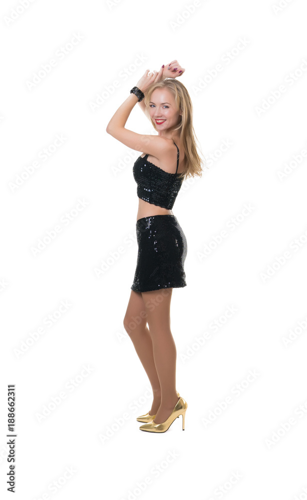 sexy girl dancing in the studio on a white background in a shiny dress - isolated sexy girl dancing in the studio on a white background in a shiny dress - isolated