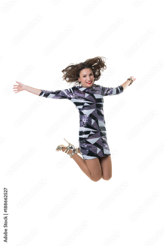 beautiful happy girl jumping in the studio on a white background. the joy of shopping. freezing jump - flying girl. beautiful happy girl jumping in the studio on a white background. the joy of shopping. freezing jump - flying girl.