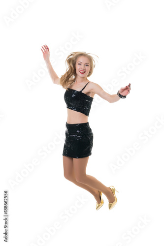 beautiful happy girl jumping in the studio on a white background. the joy of shopping. freezing jump - flying girl.