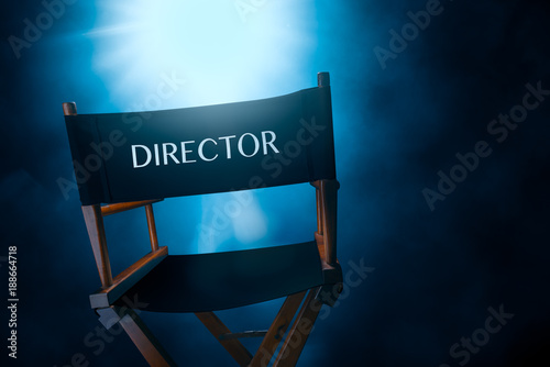 Back of a vintage director chair on a smokey background , high contrast image