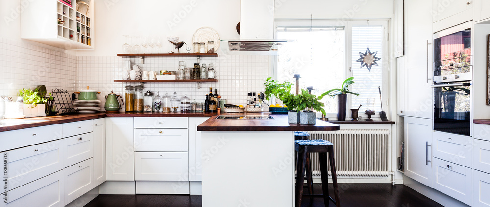 horizontal banner of a fancy kitchen interior with dark wooden floor and kitchen counter top horizontal banner of a fancy kitchen interior with dark wooden floor and kitchen counter top