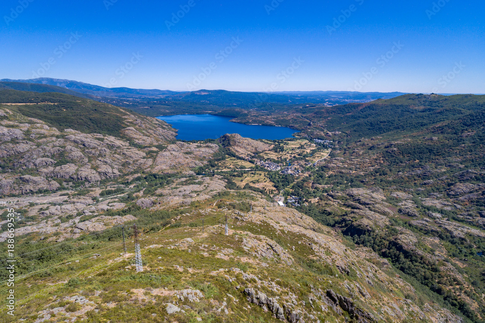 Aerial view of Sanabria lake and electric towers (Spain)