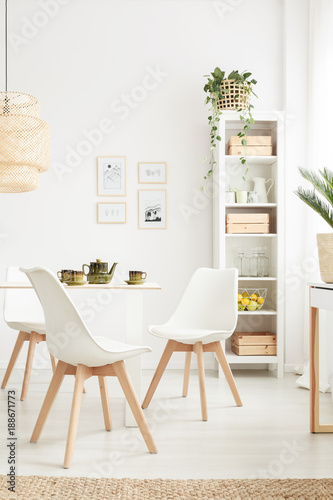 Simple chairs at table photo