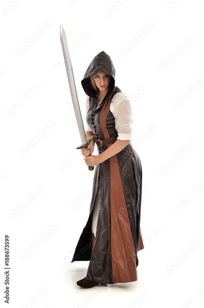 Styled Portrait Of Young Warrior Woman Holding Sword Stock Photo - Download  Image Now - iStock