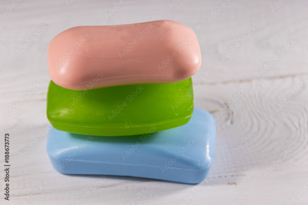 Set of colorful soap on white wooden background Set of colorful soap on white wooden background