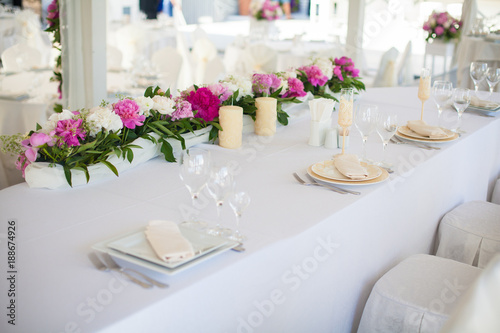 Elegant flower decoration on the table in restaurant for an event party or wedding table