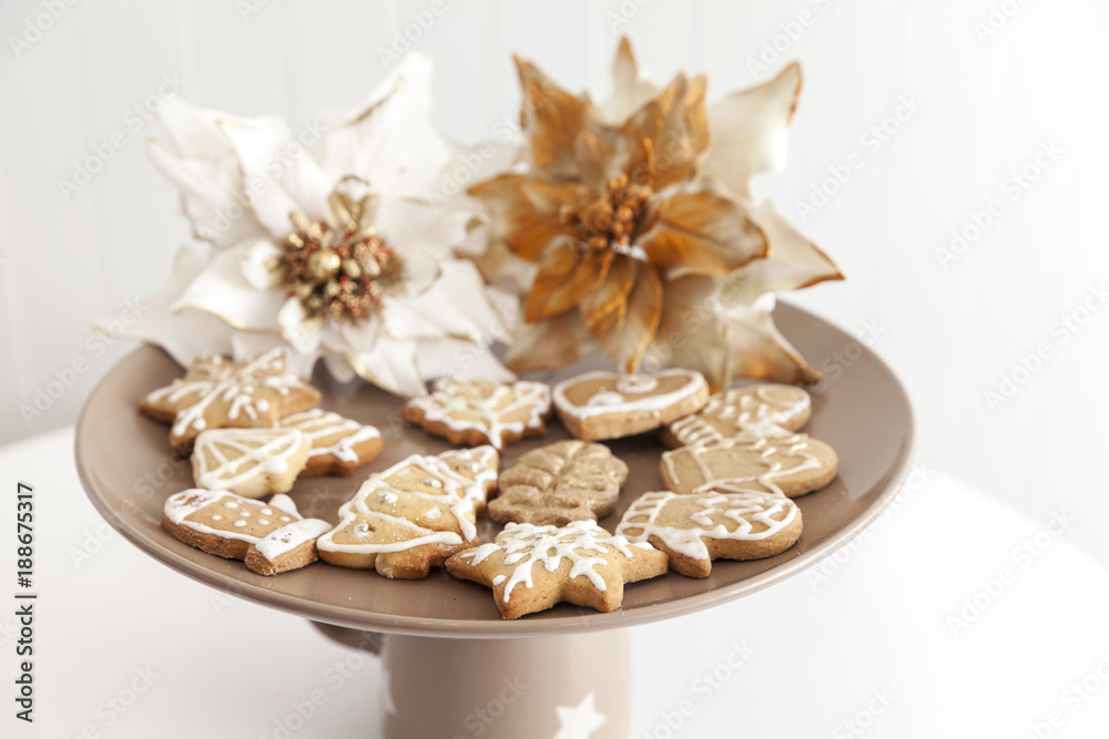 Fototapeta premium gingerbread cookies on a plate with Christmas motifs