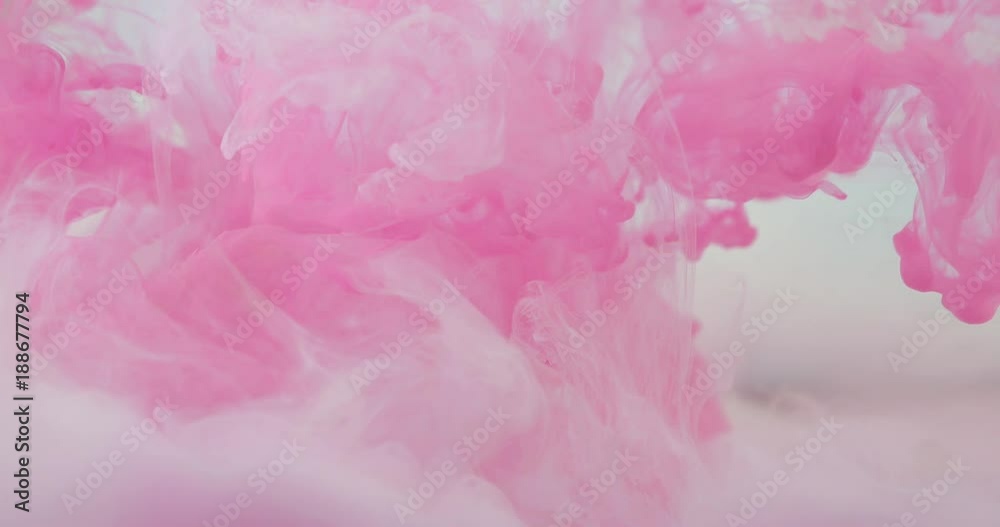 By launching paint in the water, they create a unique abstraction from colored clouds in space