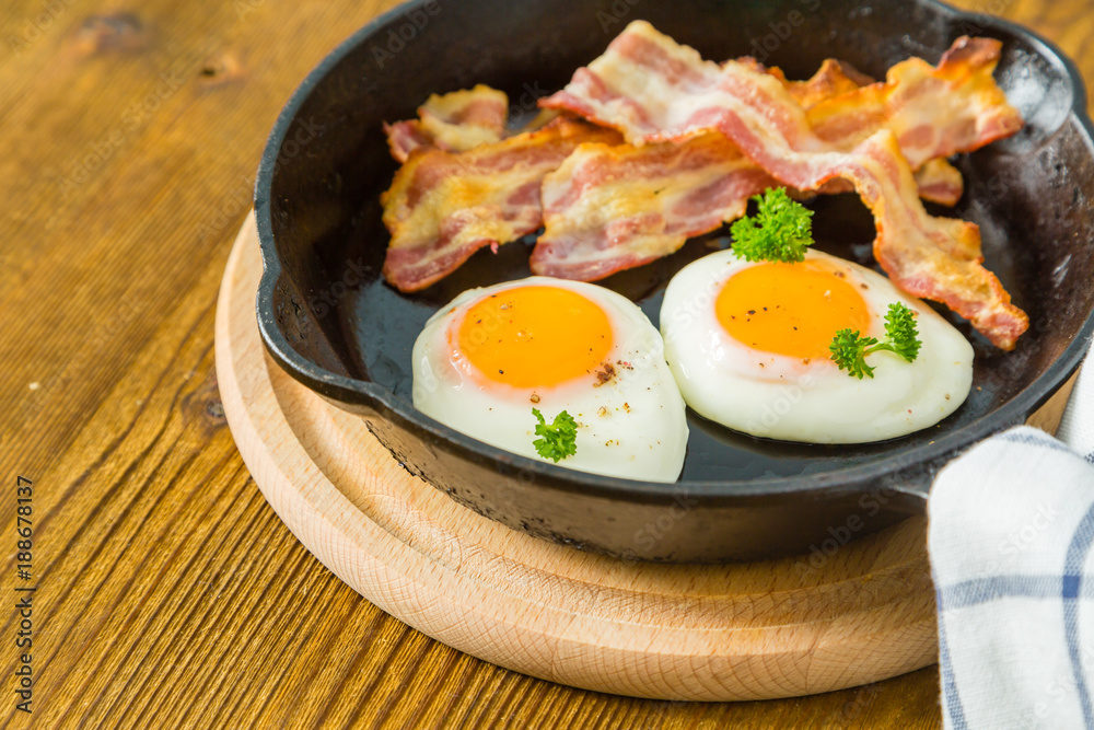American breakfast with sunny side up eggs, bacon American breakfast with sunny side up eggs, bacon