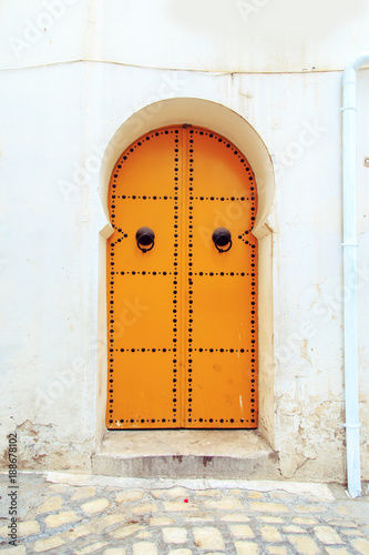 Traditional  door with ornament in Hammamet. © lizavetta