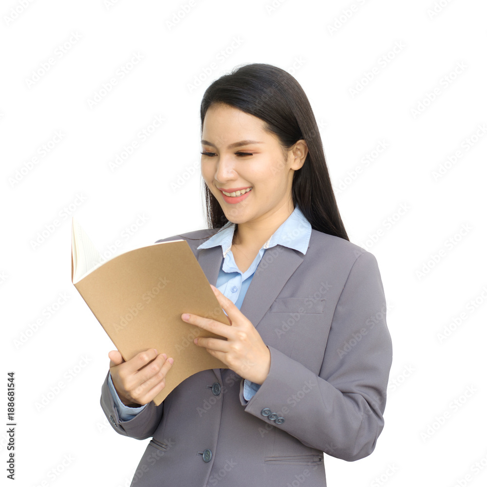 Asian young girl holding a brown book isolated on white background. Asian young girl holding a brown book isolated on white background.
