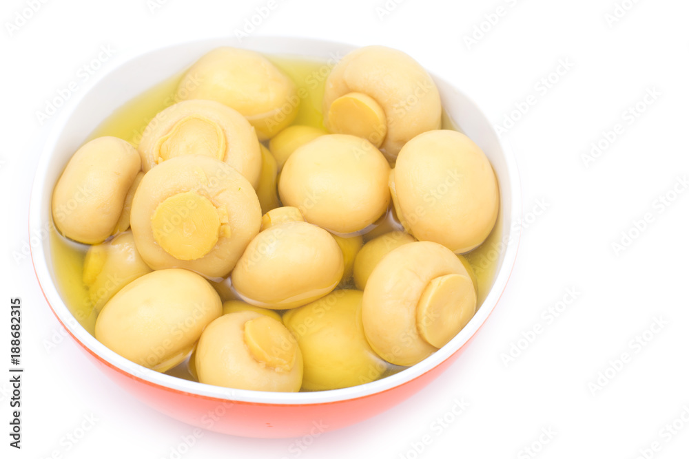 whole champignon mushrooms in brine isolated on white background whole champignon mushrooms in brine isolated on white background
