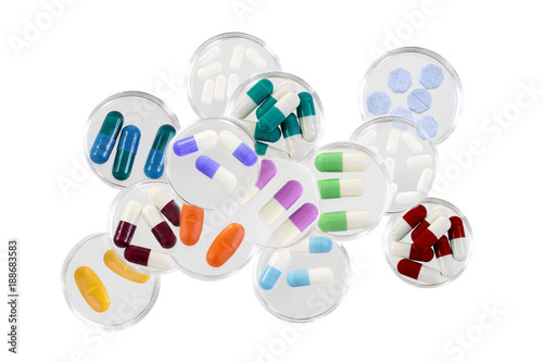Healthcare and mmedical concept: addiction,stack of Medicine Tablets in glass petri dish on white background photo