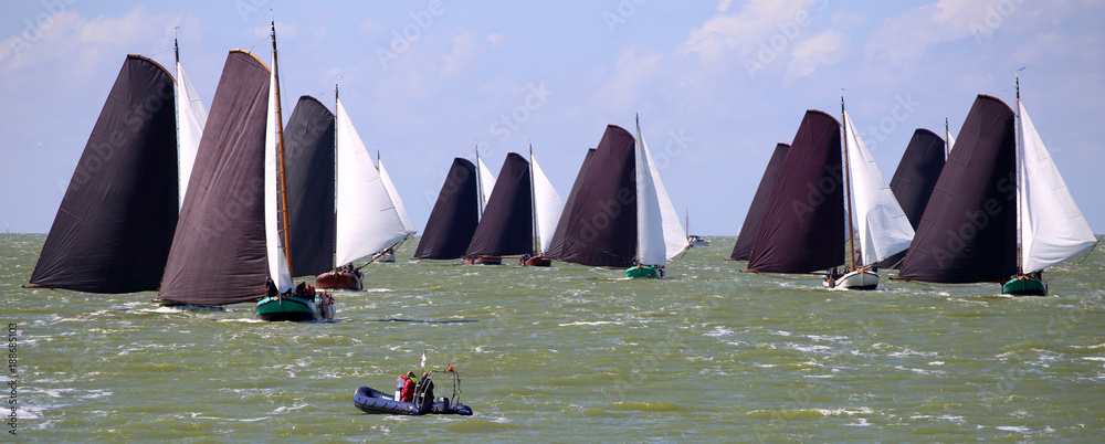 Fototapeta premium Traditional Frisian wooden sailing ships in a yearly competition on the Ijsselmeer, The Netherlands