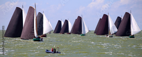 Traditional Frisian wooden sailing ships in a yearly competition on the Ijsselmeer, The Netherlands