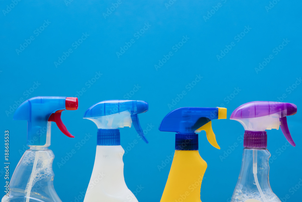 Cleaning spray bottle products on a bright blue background Cleaning spray bottle products on a bright blue background