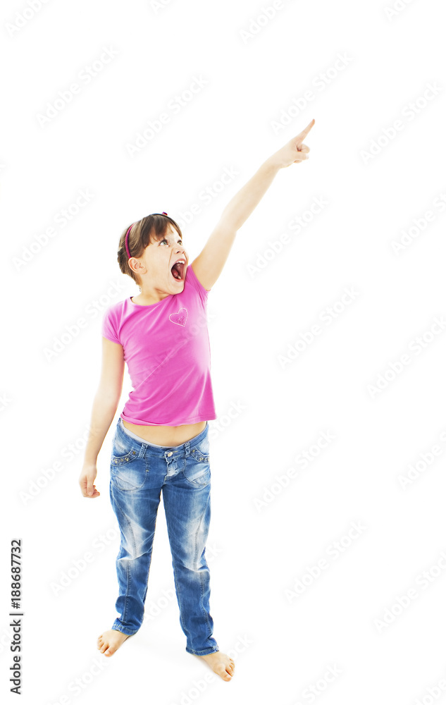 Surprised little girl pointing with finger. Isolated on white background Surprised little girl pointing with finger. Isolated on white background
