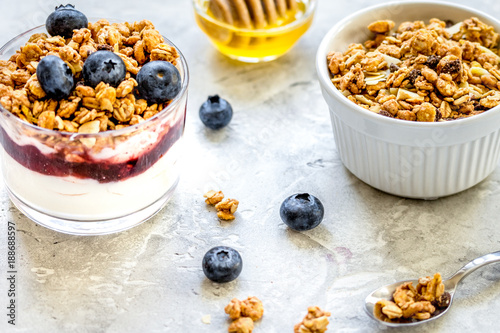 Healthy breakfast from yoghurt with muesli and berries on kitche