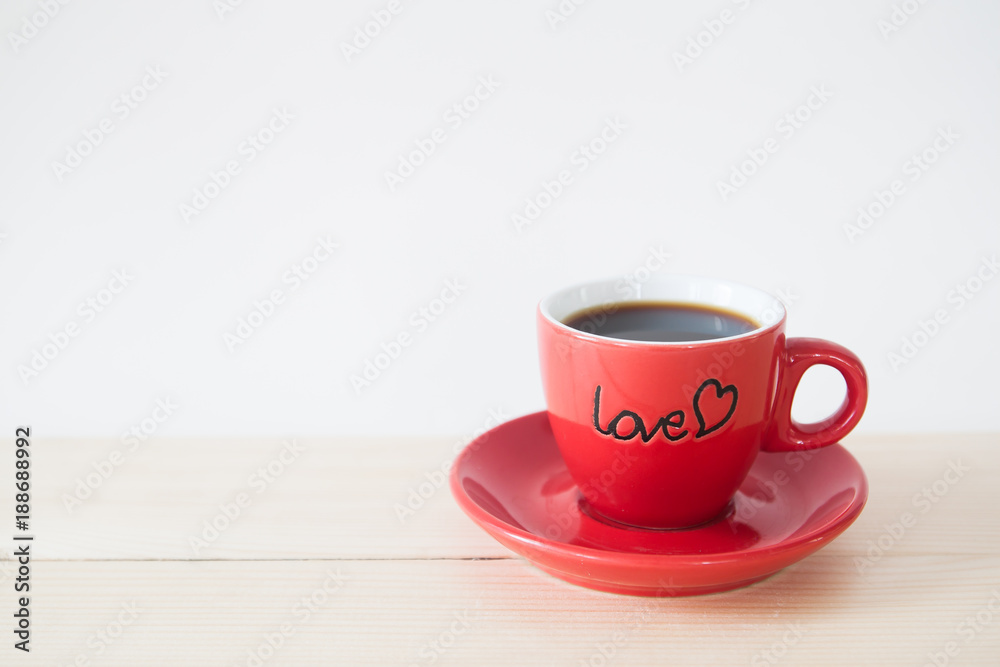 Obraz premium Hot coffee in LOVE red cup, Valentine's Day concept with copy space